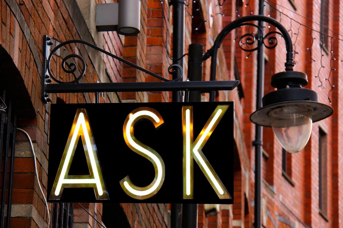 Ask sign on building wall