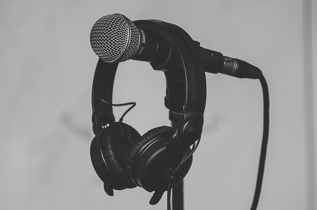 Headphones hanging over microphone on stand