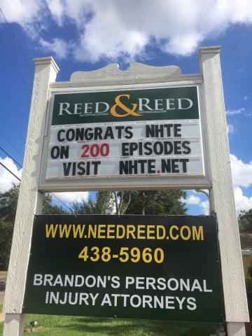 Law firm sign showing congratulations to NHTE on 200 episodes