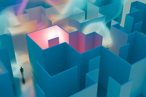 A person stands at the beginning of a futuristic looking maze