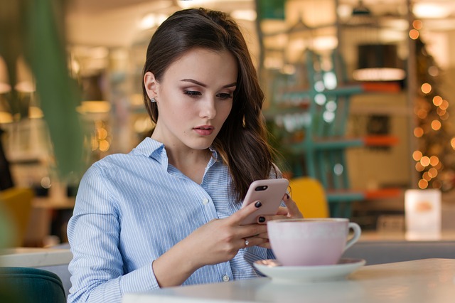 Girl reading from smartphone