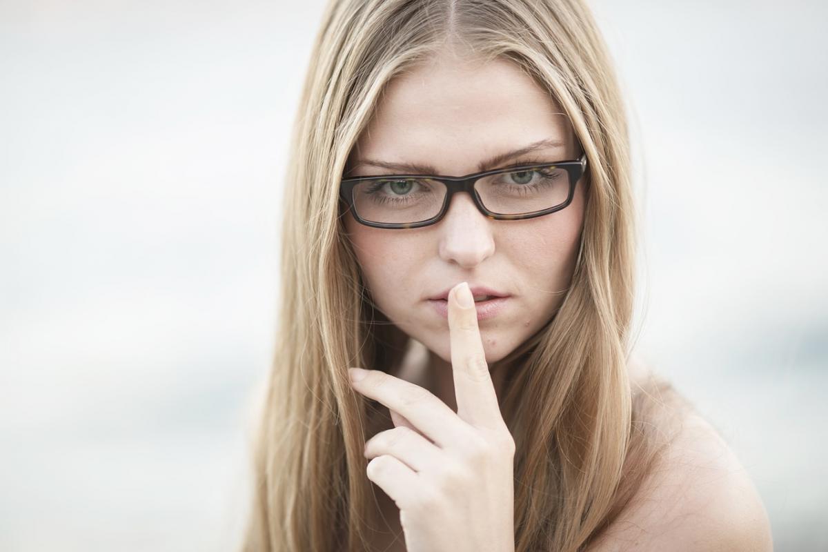 Female making shhh gesture